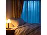 Person sleeping peacefully in a cozy bed